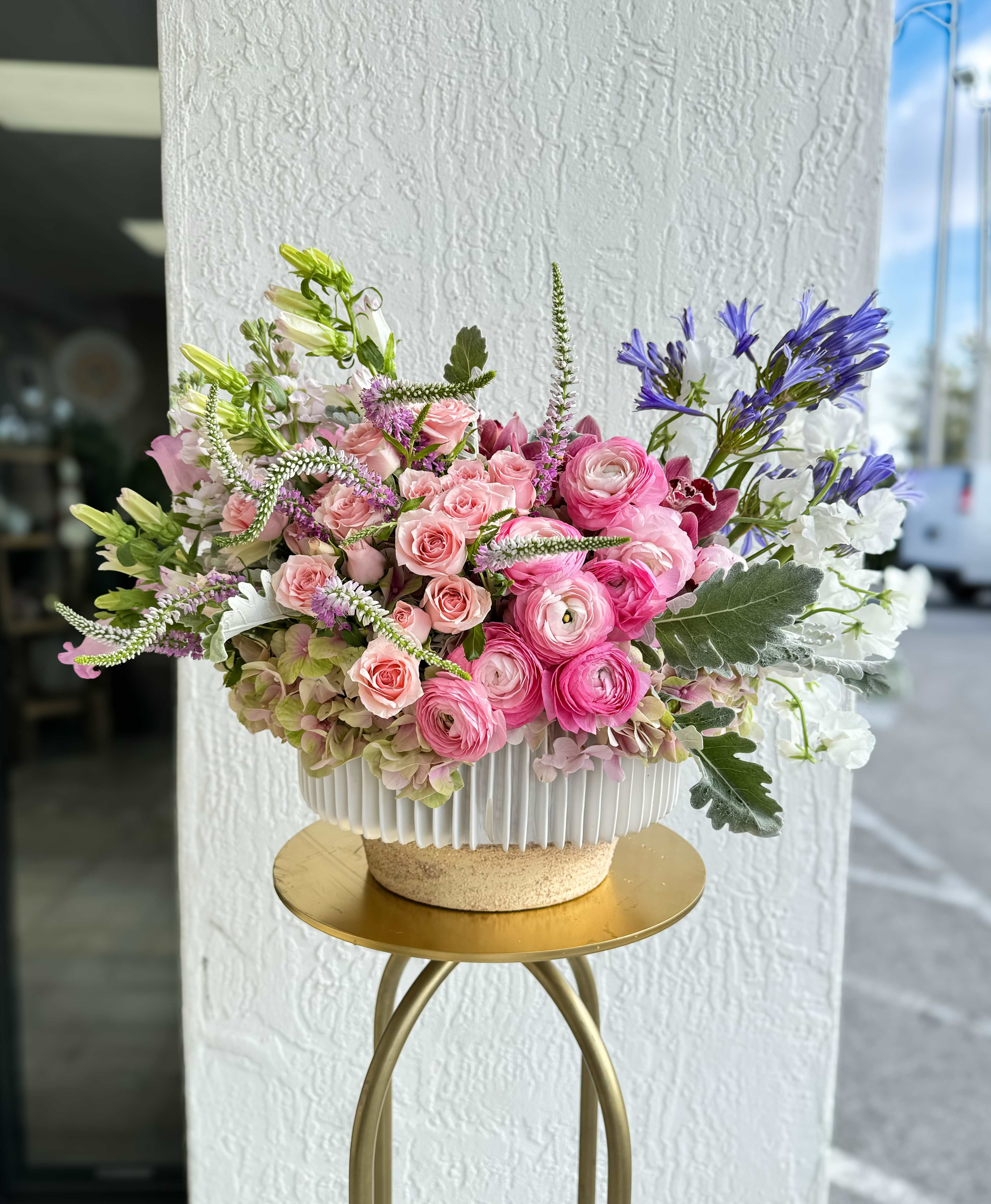 Pink Passion - A beautiful bouquet of pink passion blooms is the perfect way to show your loved one how much they mean to you. Ranunculus, Veronicas, hydrangeas, spray roses, all in a princess pink hue, create a romantic and luxurious gift. Filled with premium blooms.