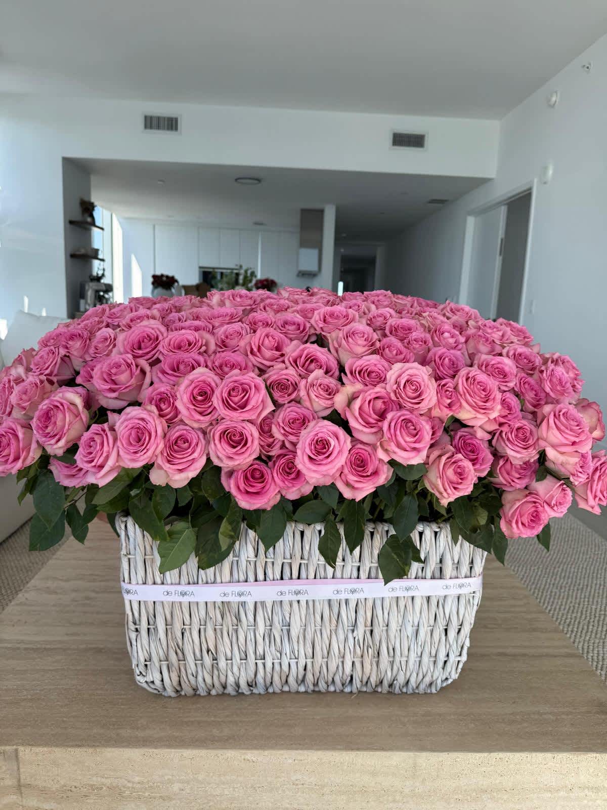 Large basket arrangement of pink roses