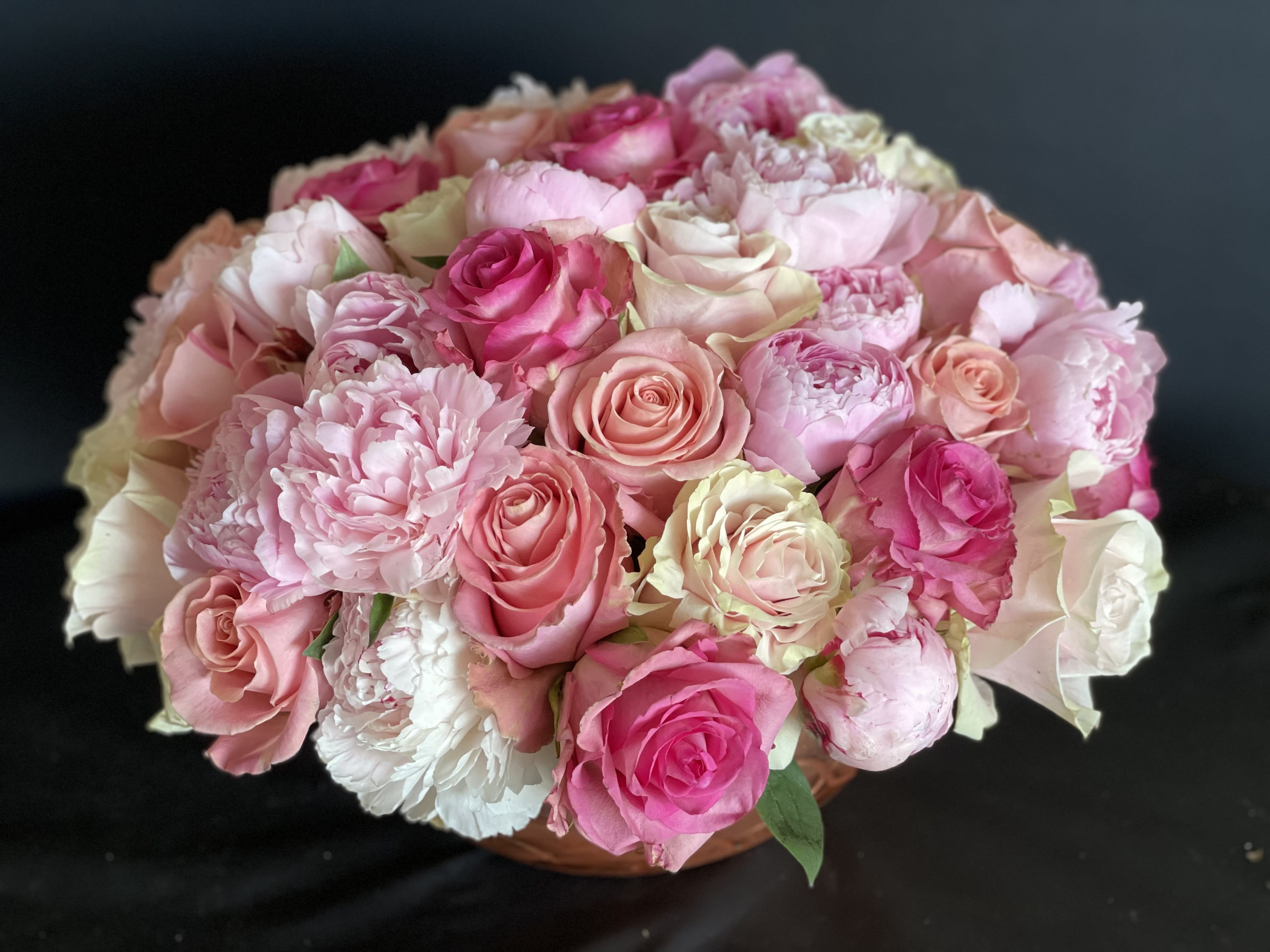  Magical Peony Rose Bowl.  - 30 pink peonies surrounded by 50 stunning roses in a a white ceramic bowl. WE REQUIRE 48 HOURS TO CREATE THIS DESIGN.