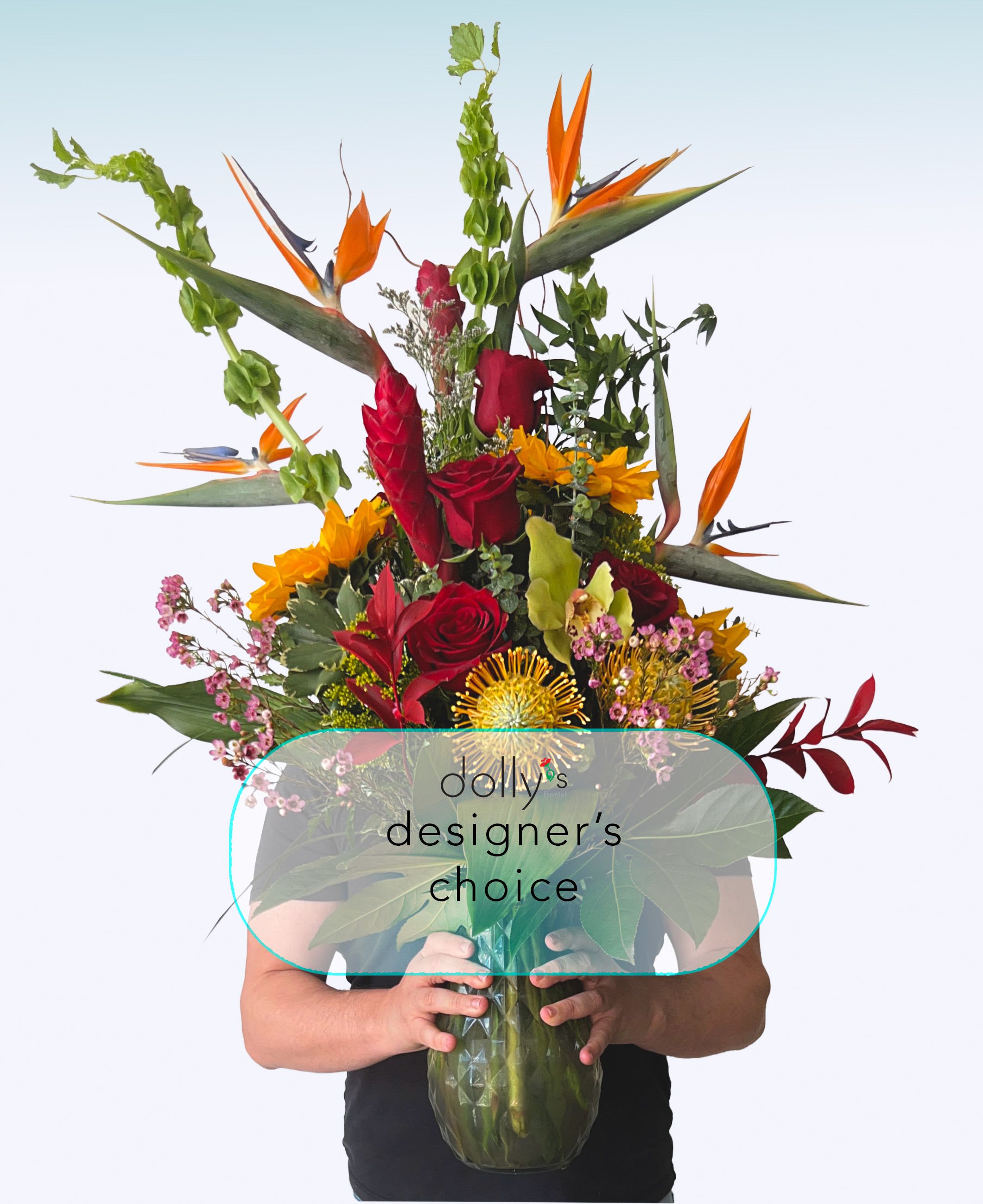 Premium | Designer's Choice - Elevate the art of gifting with our premier Designer’s Choice arrangement. Reserved for our Modern Opulence collection, this showstopper is a custom-curated symphony of the world’s most exquisite blooms. By entrusting our master designers with full creative freedom, you ensure a one-of-a-kind architectural marvel. We hand-select only the rarest, high-end imports and seasonal gems—such as Vanda orchids, premium garden roses, and exotic textures—to craft a sophisticated statement piece that defines luxury 