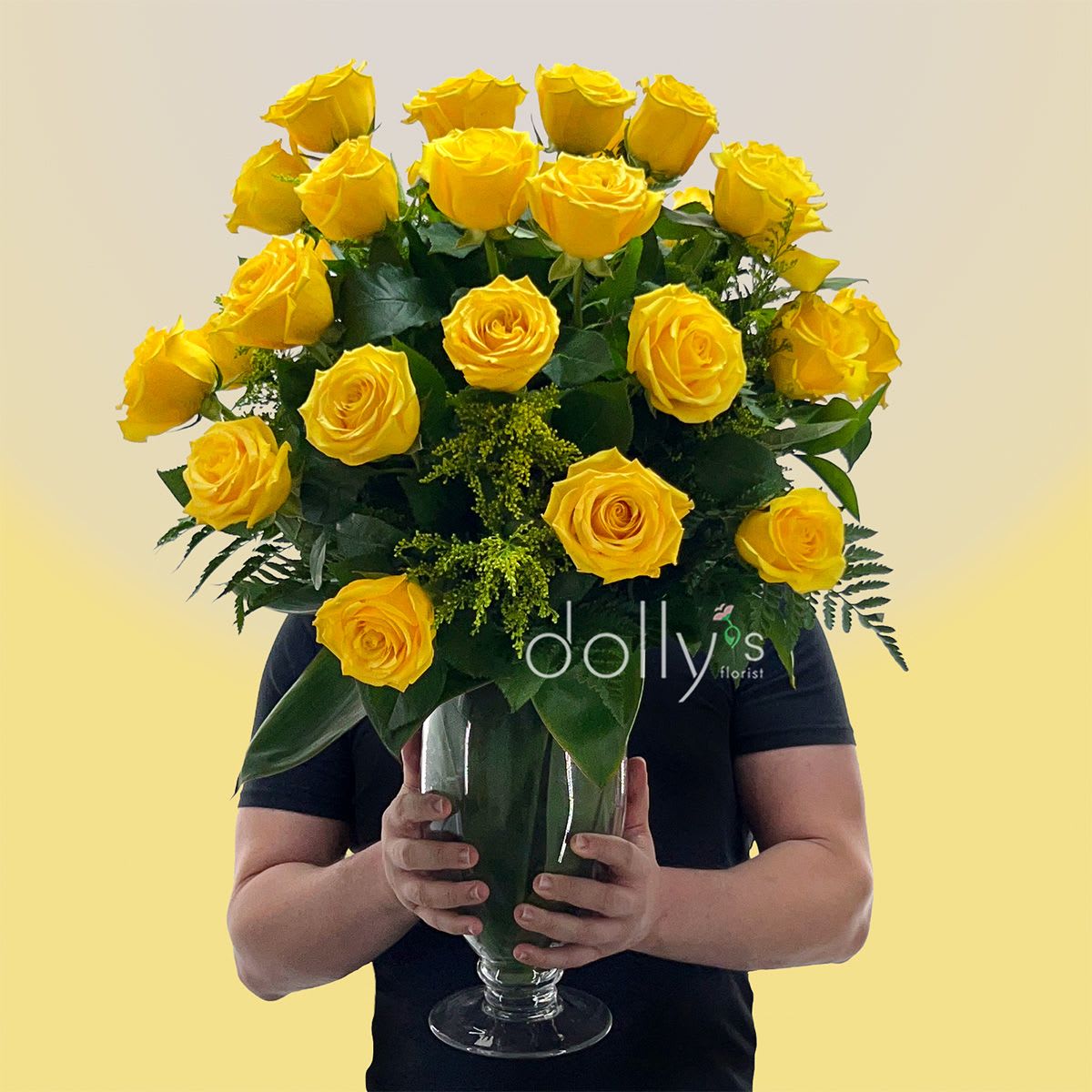 Classic 3 Dozen Yellow Long-Stem Roses  - A generous cluster of bright yellow roses makes a bold, joyful statement-perfect as a birthday bouquet or celebratory arrangement to mark an anniversary or promotion. This flower arrangement features three dozen long-stem yellow roses arranged upright for a polished, formal look; the color and classic rose shape say "congratulations" or "thinking of you" with sunny confidence that will make the recipient feel truly celebrated.  Each full, tightly layered bloom sits against rich dark-green foliage that gives depth and contrast, with touches of white from the vase reflections for added freshness. The stems are presented in a tall clear glass vase that lends an elegant, clean finish and keeps the arrangement substantial and display-ready on a table or entryway console. The upright shape and abundant heads create a long-lasting visual impact ideal for celebratory rooms or as a standout everyday gift.  This arrangement is designed for gifting-she'll feel noticed and uplifted whether it marks a special day or brightens an ordinary week. Vase-ready for immediate enjoyment; to keep the roses looking their best, refresh the water and trim stems every few days.