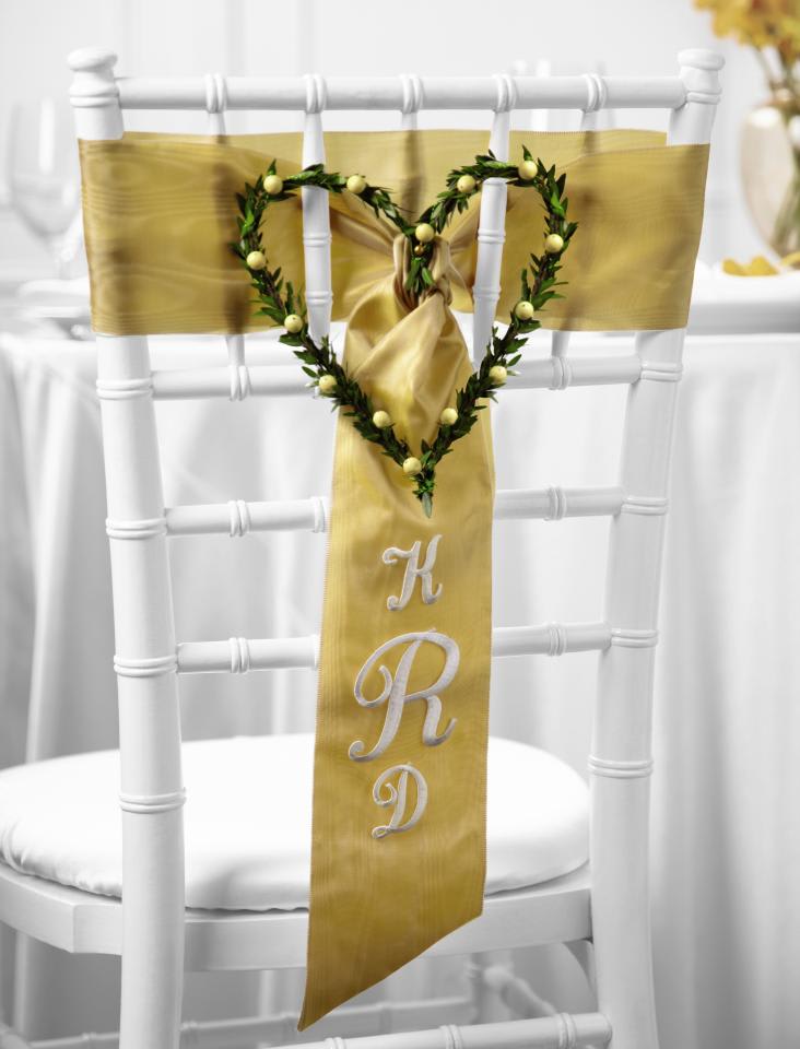 FTD Steal My Heart Chair Decor - The FTD Steal My Heart Chair DÃ©cor is one of those special touches to   your wedding dÃ©cor that will have your guests raving about the day for   years to come. Peach hypericum berries and mini myrtle stems form a   perfect heart centered on a wide gold satin ribbon accented with the   initials of the bride and groom. Approx. 9H x 9W.   