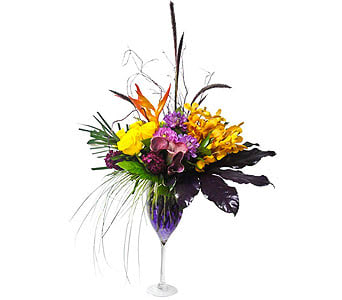 If You Believe in Magic  - Let Newport Florist make the magic for youâ¦    Yellows and lavanders accented in this beautiful contemporary wine glass vase in an inspiration for a magic day! â¦. Golden yellow roses, lavender minicallas, cat tail, curly willow, tropics, mokara orchids and more to close up the concept of the magic        As Shown : NF155    
