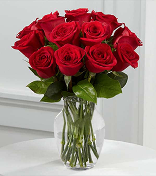 True Love Valentine Rose Bouquet - 12 Stems - VASE INCLUDED - Picked fresh from the farm, the True Love Valentine Rose Bouquet is a classic way to express your love and affection this coming February 14th! 12 stems of our finest red roses picked fresh from the farm arrive to bestow your sweetheart with their rich color and soft fragrance to make this a Valentine's Day they won't soon forget. BETTER Bouquet is approximately 14" H X 10" W. Your purchase includes a complimentary personalized gift message. 
