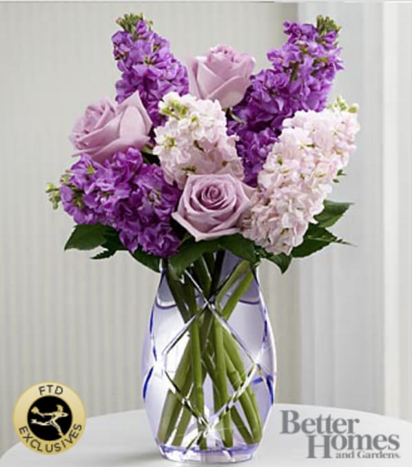 The FTD® Sweet Devotion™ Bouquet by Better Homes and Gardens® -CUT GLASS VASE INCLUDED - The FTD® Sweet Devotion™ Bouquet by Better Homes and Gardens® brings together roses and stock stems to design a wonderful wish for perfect happiness for your special recipient. Lavender roses and stock are accented with pink stock and lush greens to create an amazing flower bouquet. Lovingly arranged in a designer lavender etched glass vase, this flower arrangement offers them a beautiful expression of your sweetest sentiments to celebrate Mother's Day, extend your happy birthday wishes or to help celebrate the arrival of spring. GOOD bouquet is approximately 17"H x 13"W. BETTER bouquet is approximately 19"H x 14"W. BEST bouquet is approximately 20"H x 16"W. Your purchase includes a complimentary personalized gift message.