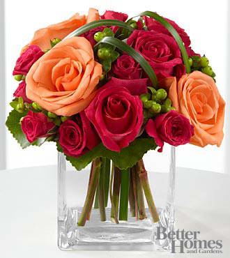 The FTD® Deep Emotions® Rose Bouquet by Better Homes and Gardens® - B25-4401S  FTD® presents the Better Homes and Gardens® Editors' Choice Deep Emotions™ Rose Bouquet to shower your special recipient with affection. Hot pink roses and spray roses share the spotlight with orange roses, hypericum berries and lily grass arranged in a clear glass vase. Freshly eye-catching, this bouquet evokes warm feelings with its charm. GOOD bouquet is approximately 8"H x 6"W.