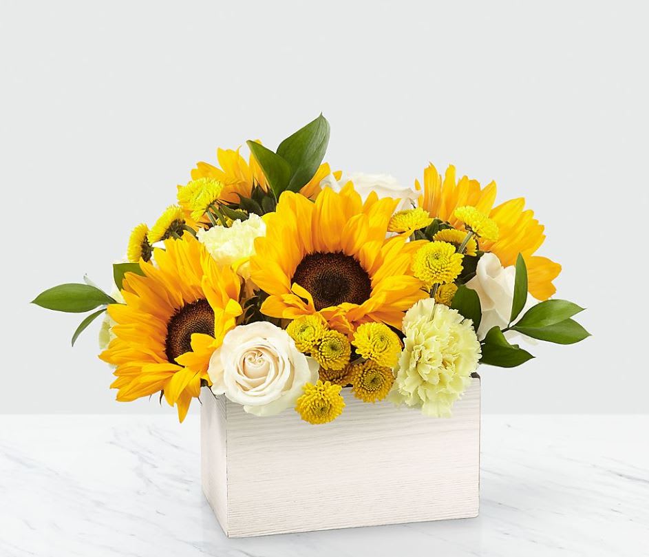 Sweet as Lemonade Sunflower Bouquet - This sunny bouquet is perfect for the sweetest person you know! Inspired by the warm weather favorite, our Sweet as Lemonade™ Bouquet is crafted with sunflowers, roses and carnations by a local florist and delivered right to them.