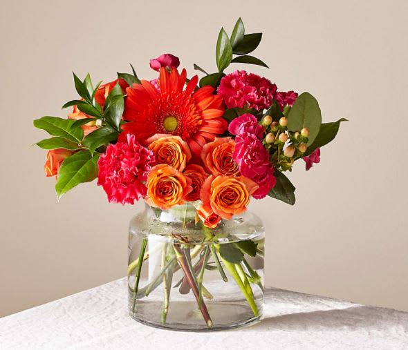 Fiesta Bouquet - The Fiesta Bouquet is composed of a lively mix, fit to celebrate any and every moment. With a combination of vibrant flowers, this florist–designed arrangement brings a pop of color and a burst of excitement as soon as it arrives.