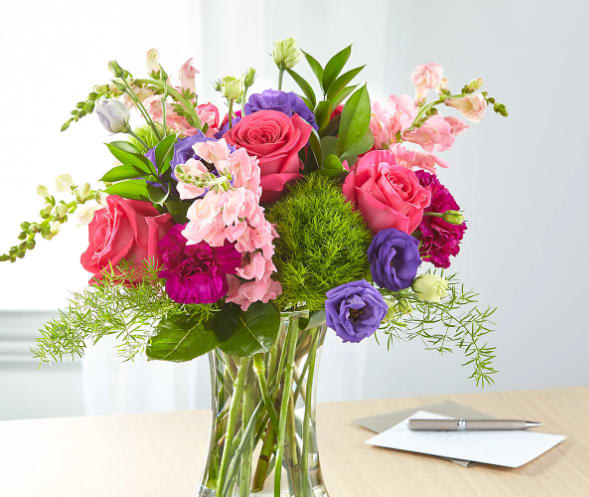 Charm &amp; Comfort Bouquet - Designed by florists, this bouquet evokes comfort and charm through its bright shades. Roses and snapdragons add gorgeous texture to complement the blooms in this arrangement.  The Original Bouquet is approximately 16"H x 18"W.