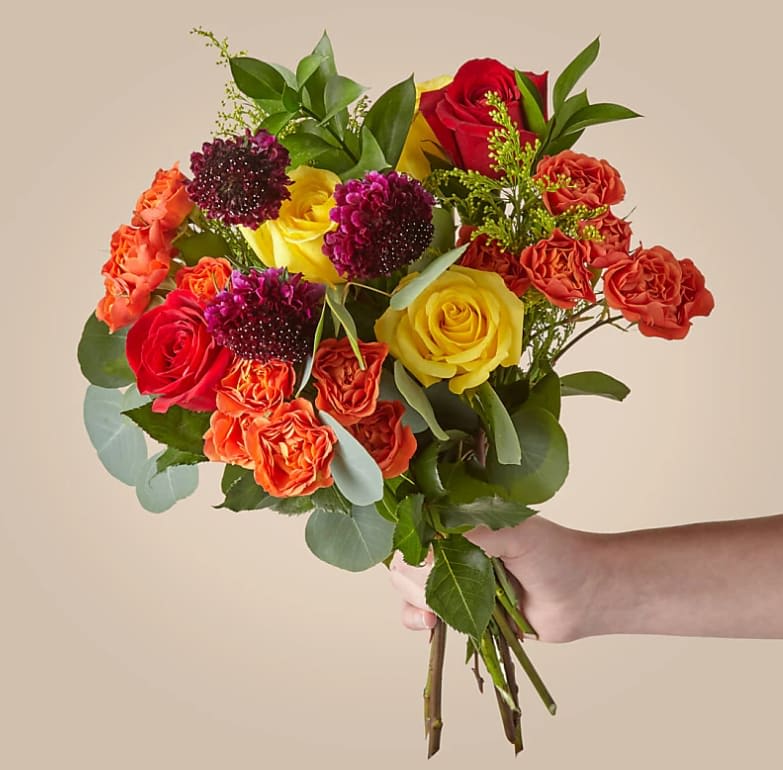 Wild Autumn Bouquet - Bring the breathtaking beauty of fall in with Wild Autumn. The vibrant colors and texture of roses, scabiosa and eucalyptus captures the liveliness of the season and create a gorgeous gift all autumn long.  The Deluxe Bouquet is approximately 20\"H by 22\"W.