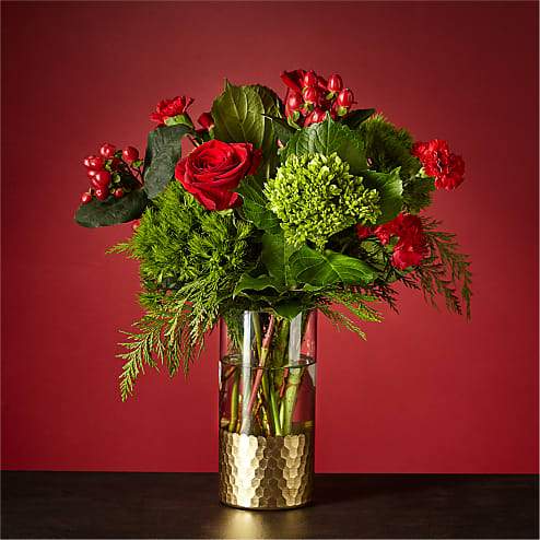 Home for the Holidays Bouquet - Why wait to unwrap gifts till Christmas morning? Send yourself this breathtaking Home for the Holidays Bouquet and let the artistry of flowers surprise you. The gold–dipped vase matches the tinsel around the tree, creating nostalgia for decked halls in your childhood home.