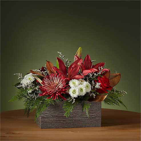 Dress the Mantel Bouquet - This Dress the Mantel Bouquet will add color and life to traditional winter décor, blooming with energetic lilies and button pompons. Whether above the fireplace or on the kitchen table, this arrangement will draw friends and family together this holiday season.