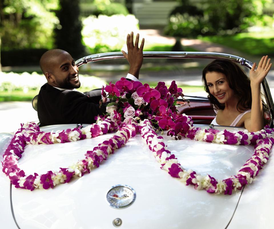 FTD Promis of Love Car Decor - The FTD Promise of Love Car DÃ©cor is the perfect way to send the   newlyweds off in style. Lavender roses and fuchsia phalaenopsis orchids   form an exquisite bouquet at the center of a 12-foot dendrobium orchid   garland to be draped on the back of the car, welcoming them into their   new life together with a touch for festive beauty. . Approx. 25âH x   18âW. 