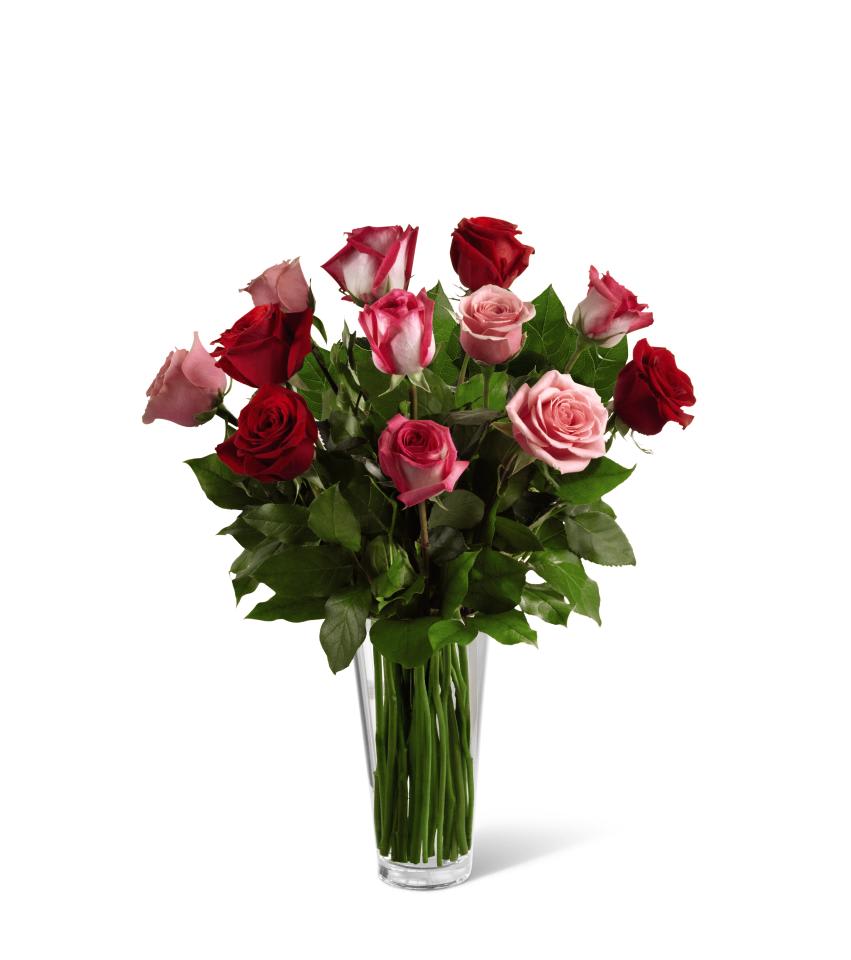FTD True Romance Rose Bouquet - The FTD True Romance Rose Bouquet is the perfect expression of love and passion to make this a truly memorable Valentine's Day. A bright burst of color, this bouquet combines red, pink and fuchsia roses, accented with beautiful greens and seated in a clear glass vase, to create a truly romantic representation of your love. 22h x 15âw