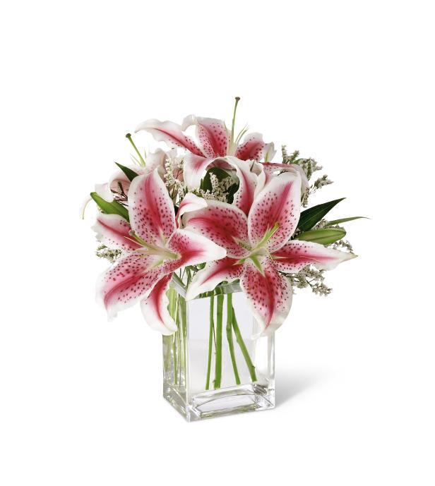 The FTD Pink Lily Bouquet - "  Send this sweet bouquet as an expression of your sympathy. Fragrant pink   Stargazer lilies are accented with pink statice and arranged in a clear   glass vase.    12âh x 10âw  "
