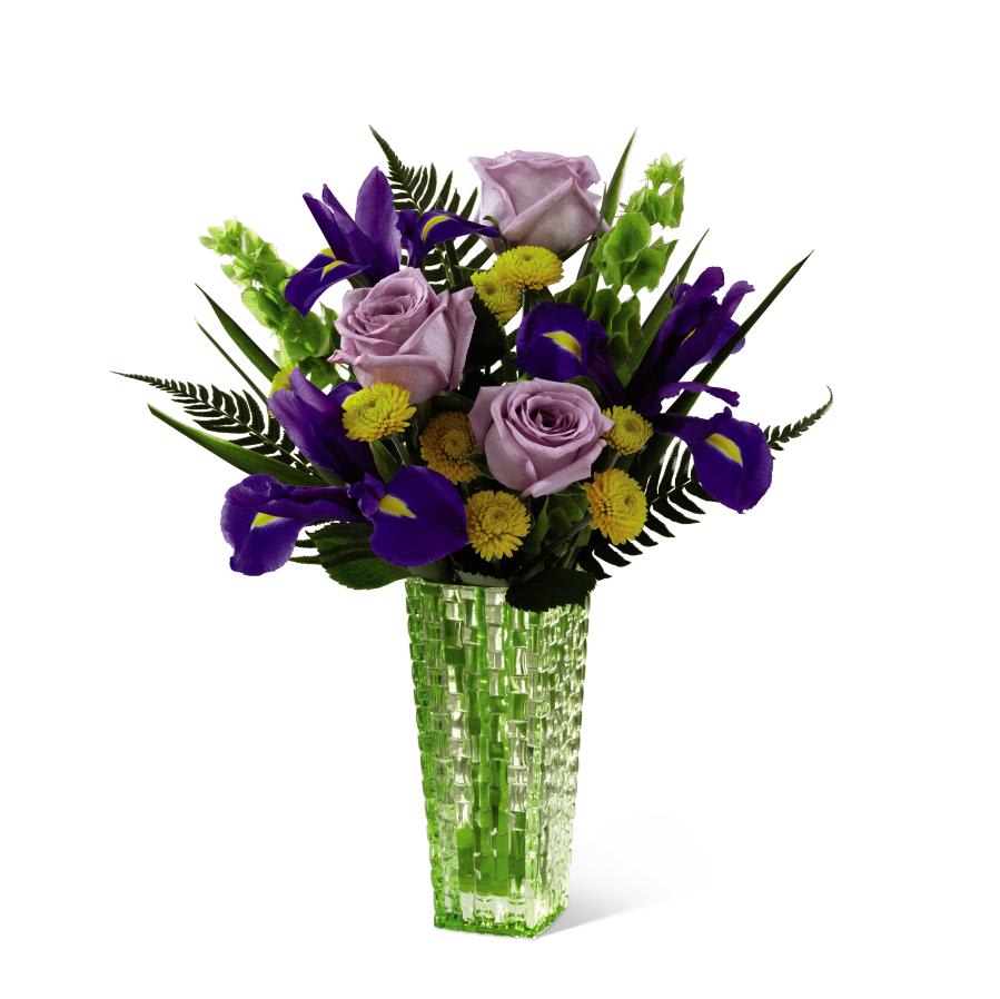 The FTD Garden Vista Bouquet by Better Homes and Gardens - FTD proudly presents the Better Homes and Gardens Garden Vista   Bouquet. Bring love and light into their day with this exquisite rose   and iris bouquet! Lavender roses, purple iris, yellow button poms, Bells  of Ireland and sword fern are delicately arranged to create an   impressive flower bouquet. Presented in a designer green glass vase,   this flower arrangement is a wonderful gift set to celebrate a birthday,  to offer your congratulations or to extend your get well wishes. GOOD   bouquet includes 10 stems. Approx. 14H x 12W. BETTER bouquet includes   14 stems. Approx. 14H x 14W. BEST bouquet includes 18 stems. Approx.   15H x 14W.   