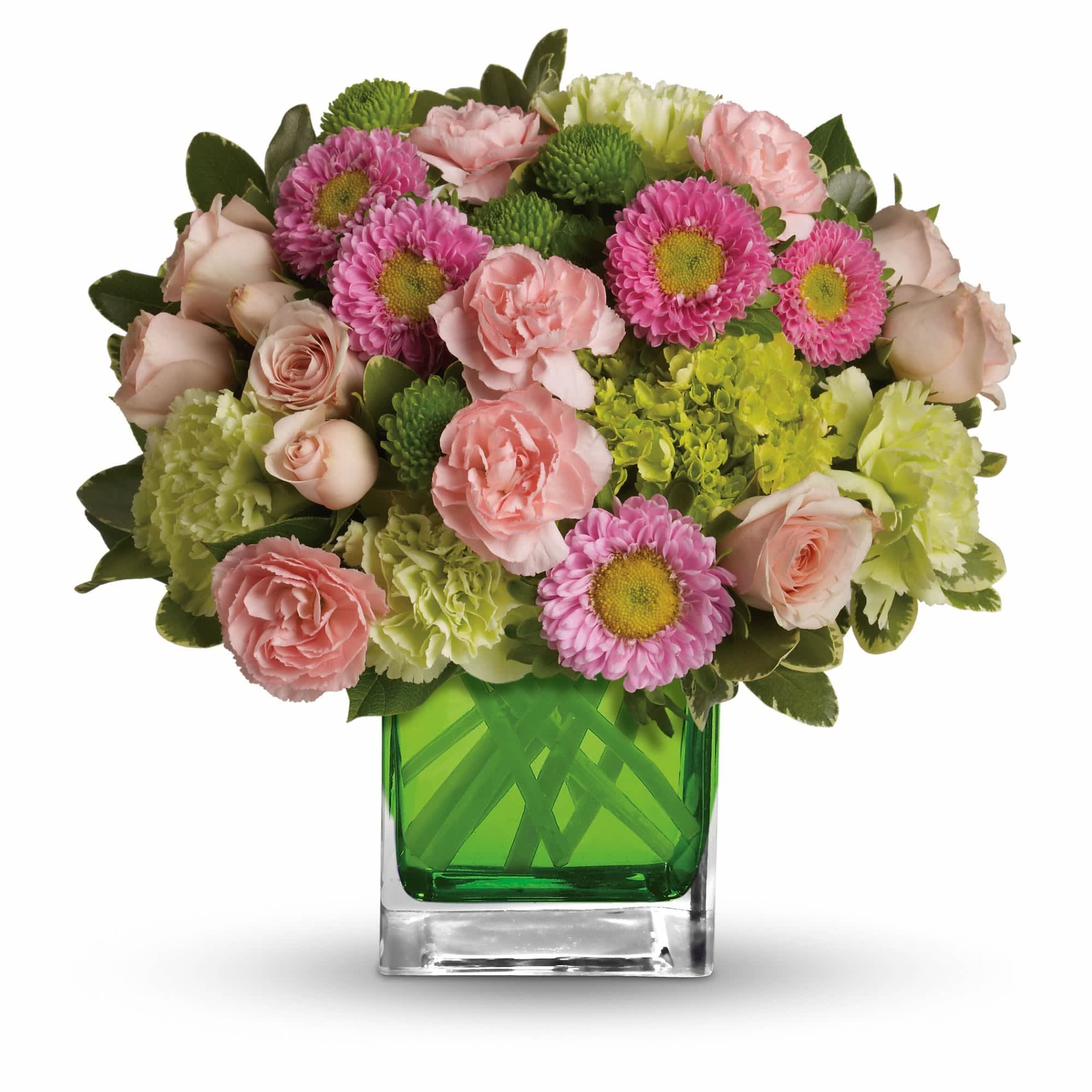 Make Her Day by Teleflora - Sweetly sophisticated, this arrangement of green miniature hydrangea and light pink spray roses presented in our citrus green glass cube is the perfect gift.    Includes green miniature hydrangea, light pink spray roses, green carnations, pink miniature carnations, pink matsumoto asters and green button spray chrysanthemums accented with assorted greens. Delivered in Teleflora's glass citrus cube.    Approximately 11 1/4" W x 11" H    Orientation: One-Sided    As Shown : TEV20-3A  Deluxe : TEV20-3B  Premium : TEV20-3C