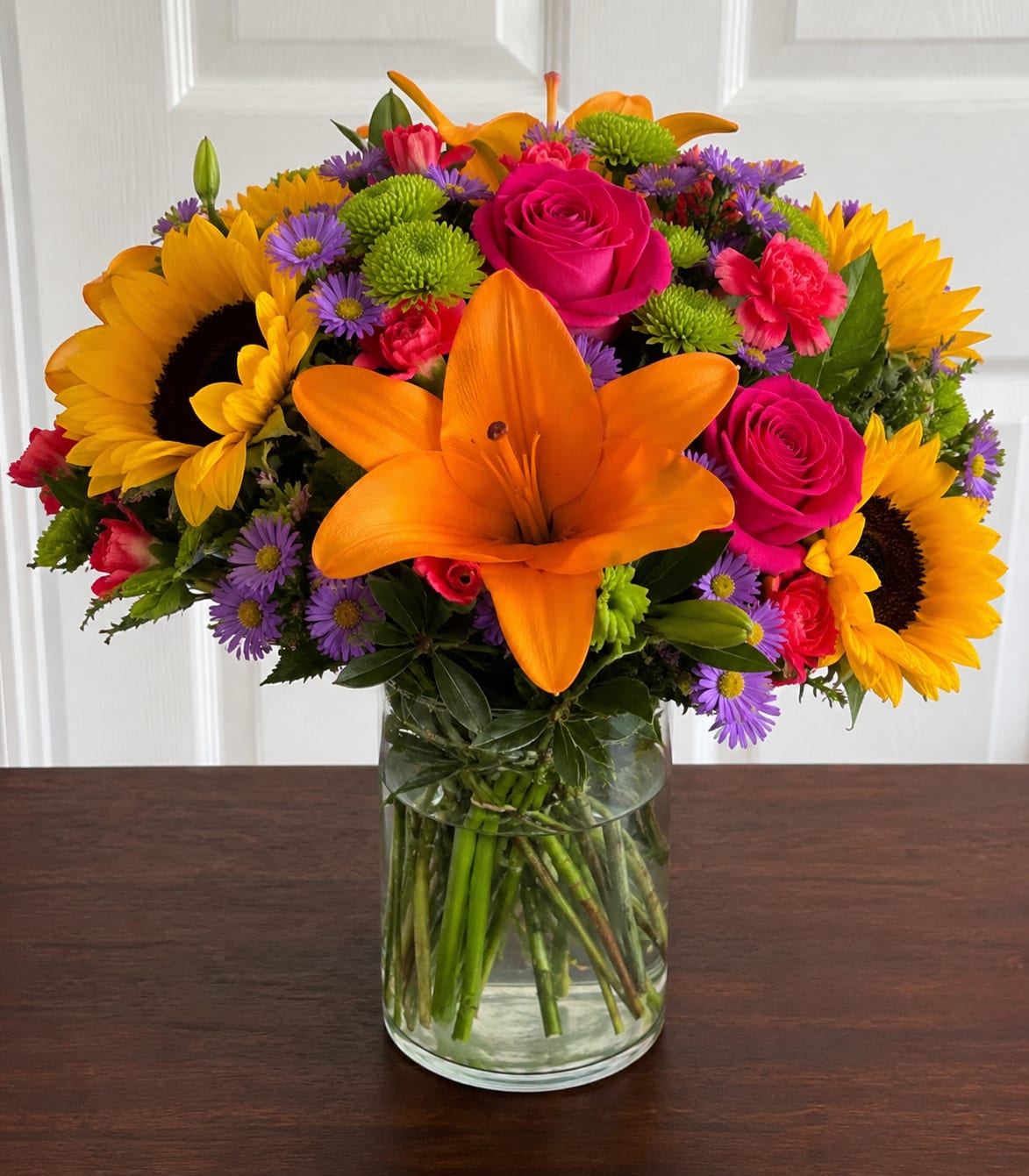 Brightness and Blooms by Petal Perfection Flower Company  - Bright and beautiful flowers in a clear vase for every occasion. 