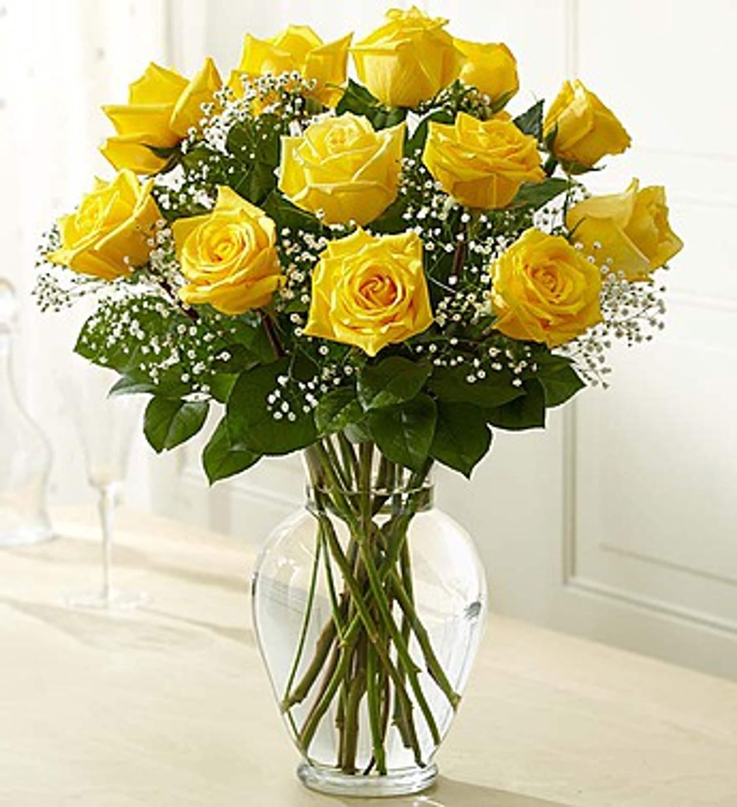 Bouquet of yellow roses in a clear glass vase