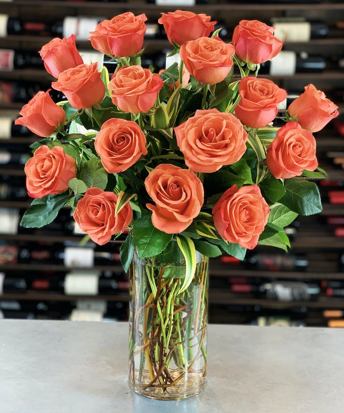 Bouquet of coral roses in a clear glass vase