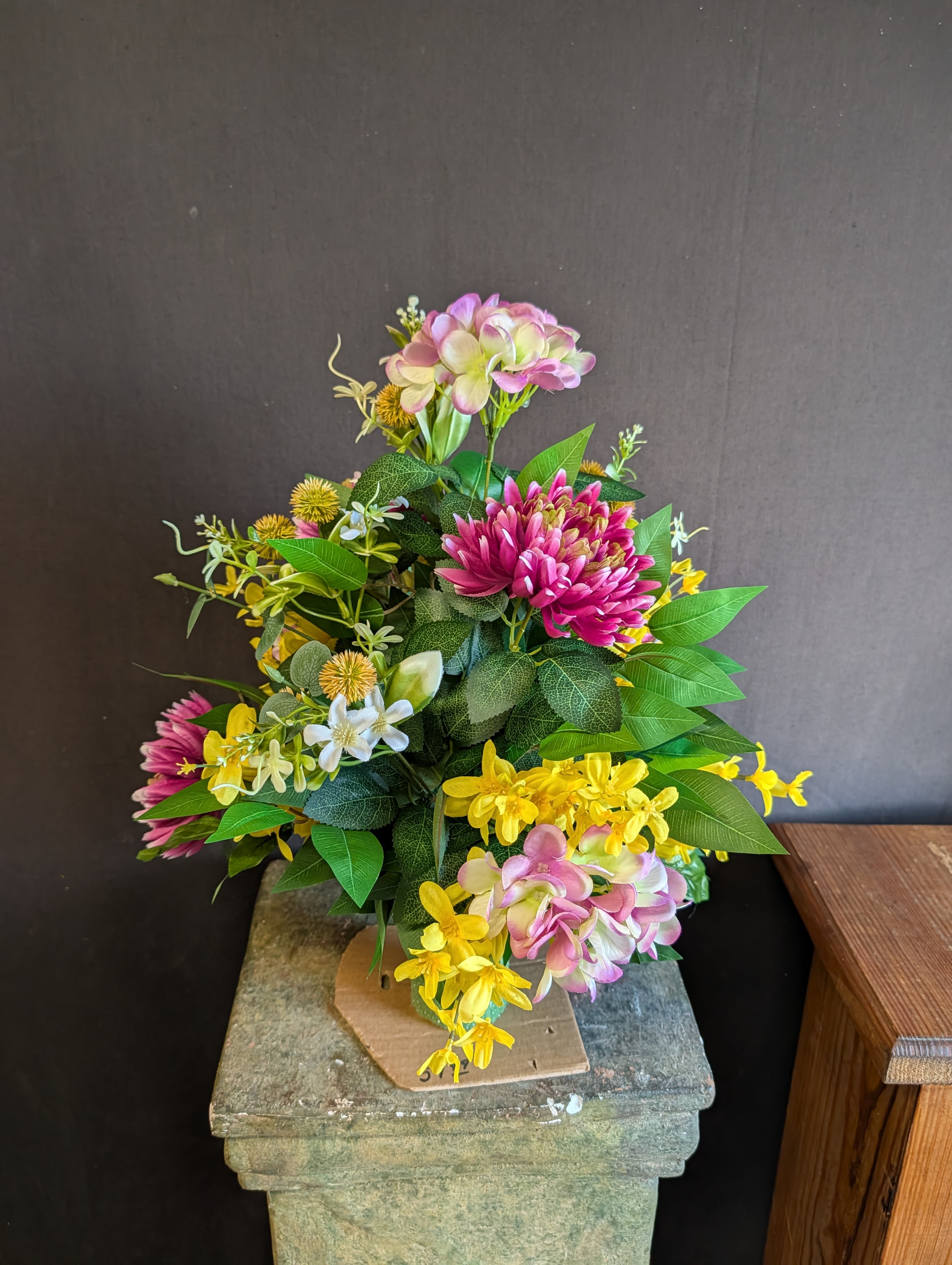 Cemetery Flower Cone - Sunshine - This silk flower arrangement is made of bright colored flowers complimented by greenery and is sure to brighten up the gravesite of your Loved One. 
