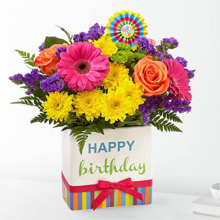 Birthday flower arrangement in a decorated box with bright mixed blooms