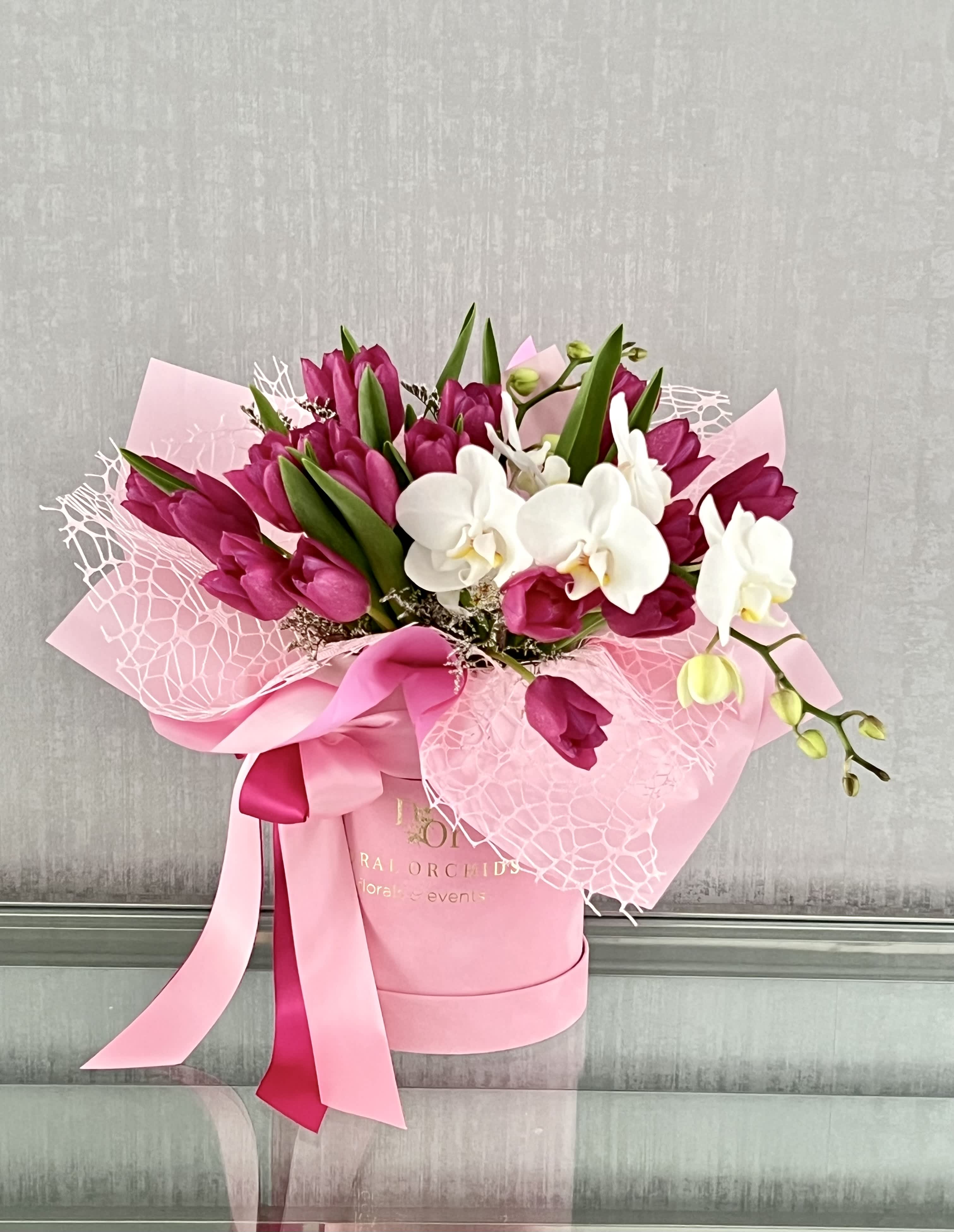 Tulips &amp; Orchids in a box ™ - 20 fresh Tulips and orchid stem combines in a trendy velvet gift box. Decorated with the satin ribbon 