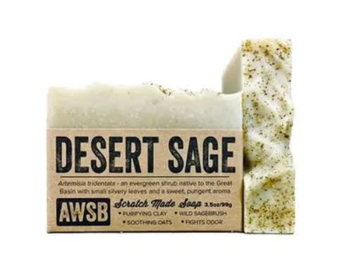 Rectangular bar of speckled desert sage soap wrapped in a kraft paper label