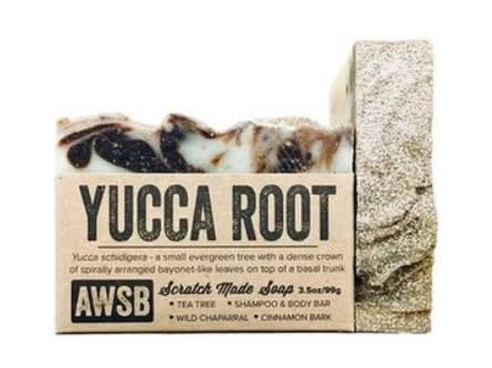 Yucca Root bar soap with a kraft paper label and marbled brown and cream top.