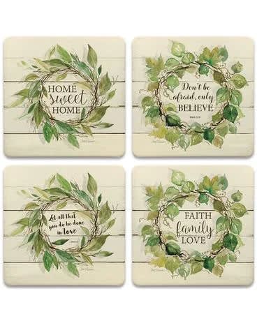 Set of four cream coasters with watercolor leaf wreaths and inspirational text