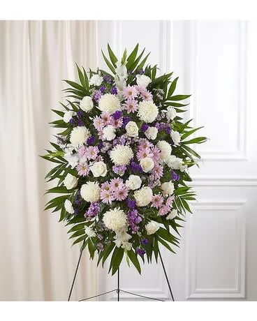 Standing floral spray with white, pink, and purple flowers