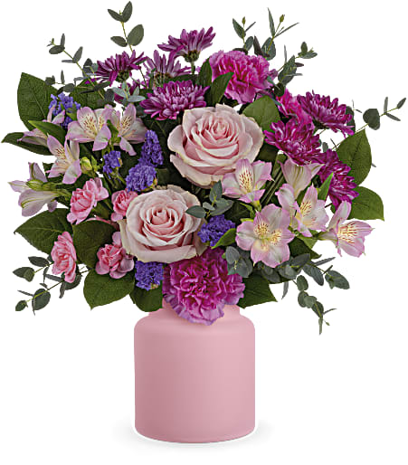 Pink and purple mixed bouquet in a pink vase