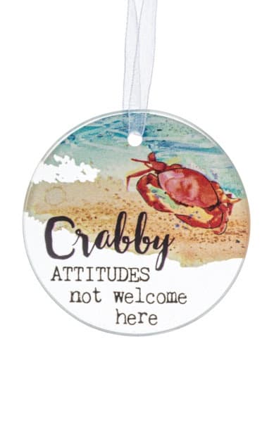 Round beach-themed hanging ornament with a red crab and playful text.