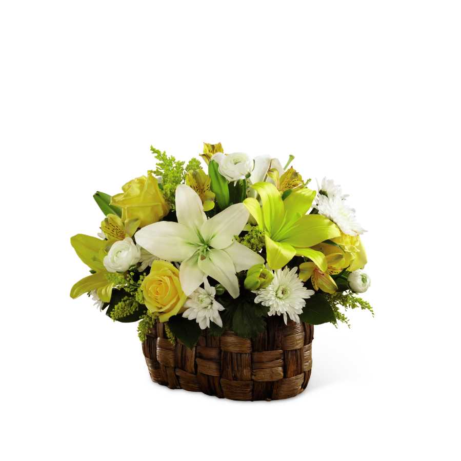 The FTD Nature's Bounty Basket - The FTD Nature's Bounty Basket bursts with the beauty of floral brilliance. Yellow roses, Peruvian lilies, solidago and LA Hybrid lilies are arranged amongst white ranunculus, chrysanthemums and LA Hybrid lilies accented with lush greens for an eye-catching look. Presented in an oval banana leaf woven basket, this sunlit arrangement will warm your special recipient's heart with its blooming perfection. GOOD arrangement includes 13 stems. Approx. 12âH x 16âW. BETTER arrangement includes 19 stems. Approx. 13âH x 18âW. BEST arrangement includes 24 stems. Approx. 14âH x 19âW.