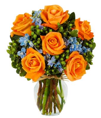 Orange You Happy Bouquet - Orange you glad we created such a beautiful and impossible-to-ignore arrangement? Orange roses are the focal point of this cheery design, yet the light blue delphinium and green hypericum certainly play an important supporting role. A clear fluted vase finishes everything off so perfectly. Small Measures 14"H X 10"L. Medium Measures 15"H X 11"L. Large Measures 16"H X 12"L.