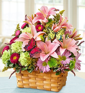 Garden Inspiration - Product ID: 91096  There's so much that inspires us about the gardenâbright colors, warm sunshine, blooming flowers. Thatâs why weâve captured it all in one beautiful basket. Filled with fresh lilies, daisy poms, carnations and more, and decorated with a pair of playful butterfly picks, this unique hand-designed arrangement is just the gift to get them smilingâwhatever the occasion. Handcrafted gathering of lilies, daisy poms, asters, carnations, poms, heather, solidago and variegated pittosporum Arranged in a splitwood handled basket they can later reuse to hold mementos or as a dÃ©cor item; measures 9.5"L Includes a pair of charming butterfly picks Large arrangement measures approximately 22"H x 12.5"L Medium arrangement measures approximately 18"H x 11"L Small arrangement measures approximately 14"H x 9.5"L Our florists hand-design each arrangement, so colors, varieties, and container may vary due to local availability Lilies may arrive in bud form and will open to full beauty over the next 2-3 days