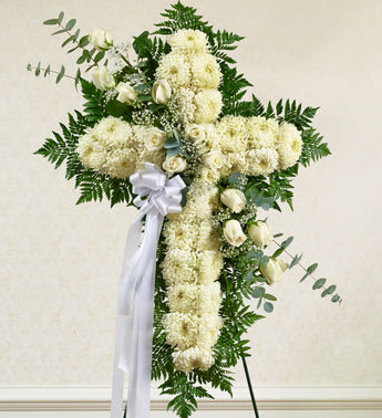 Peace and Prayers Standing Cross - White - Product ID: 91198   Send a beautiful and striking floral tribute that shows your support and love during this difficult time. This standing spray arrangement â in the shape of a cross â is created from fresh white roses, football mums, greenery and floral accents. Traditionally sent directly to the funeral home by family members or friends and displayed on a stand. Our florists use only the freshest flowers available so varieties and colors may vary. Measures approximately 42"H x 28"L without easel.