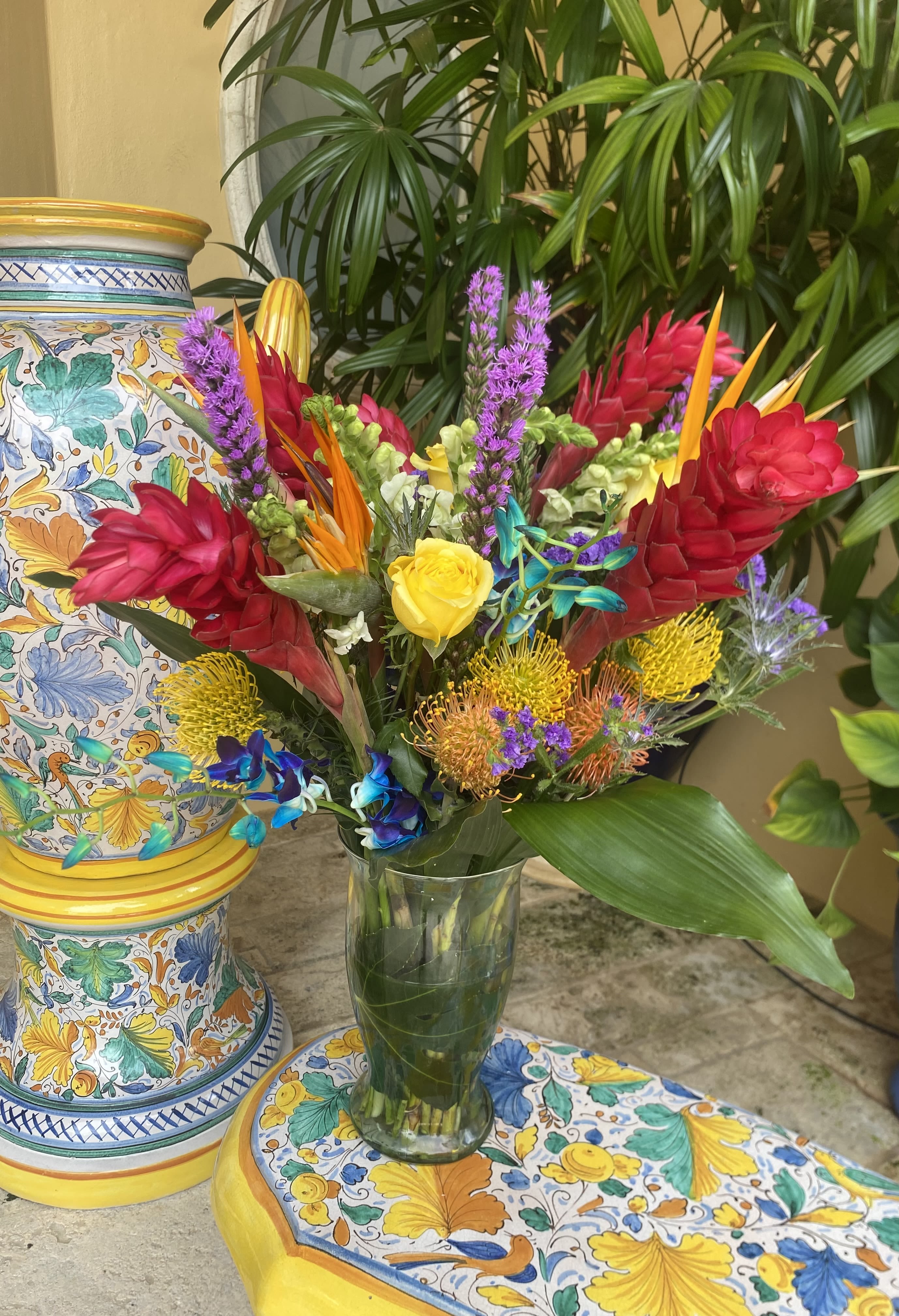 Tropical collaboration  - Tropical flowers, Roses in tall glass vase 
