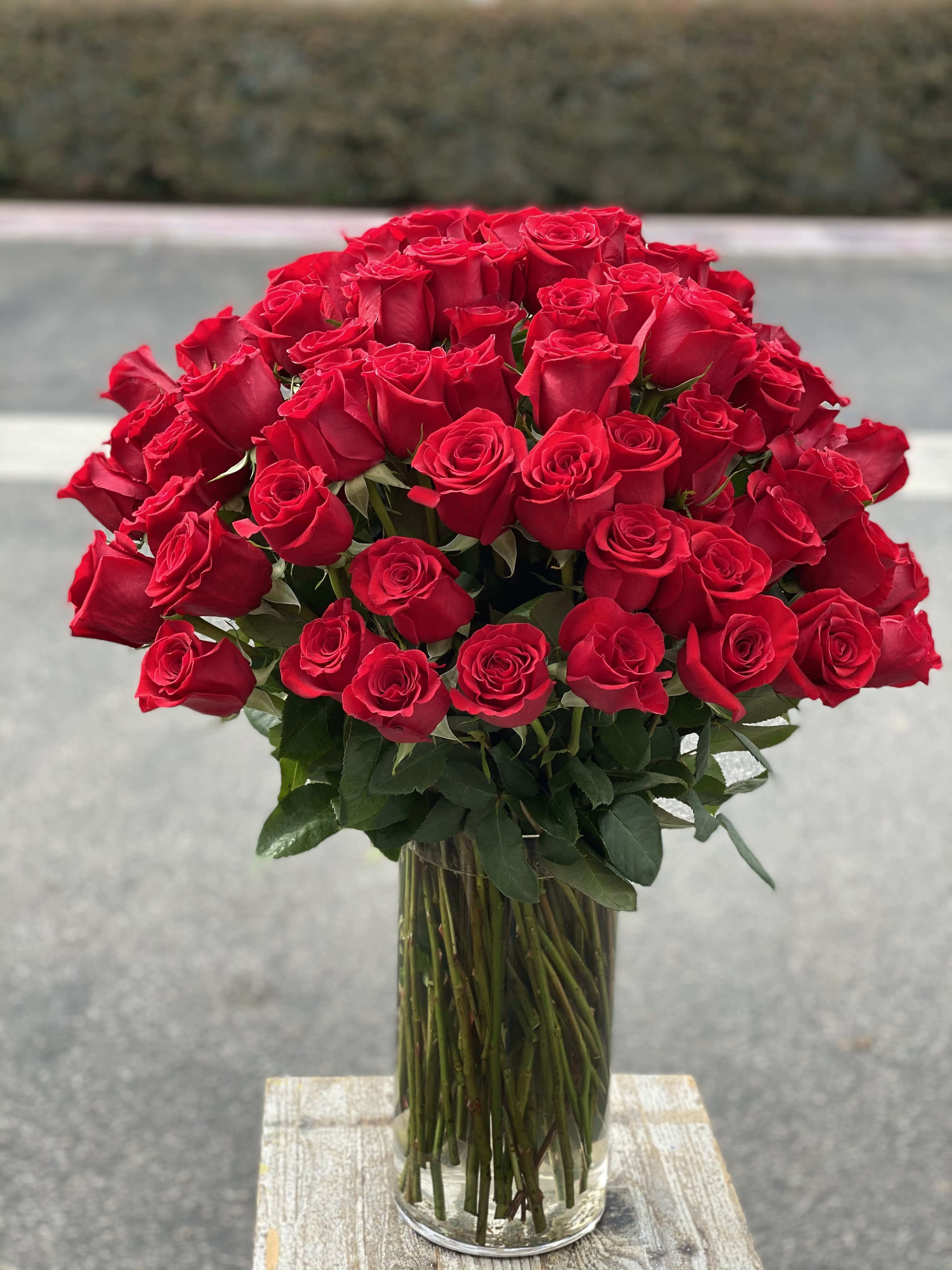 Bouquet of red roses in a clear glass vase