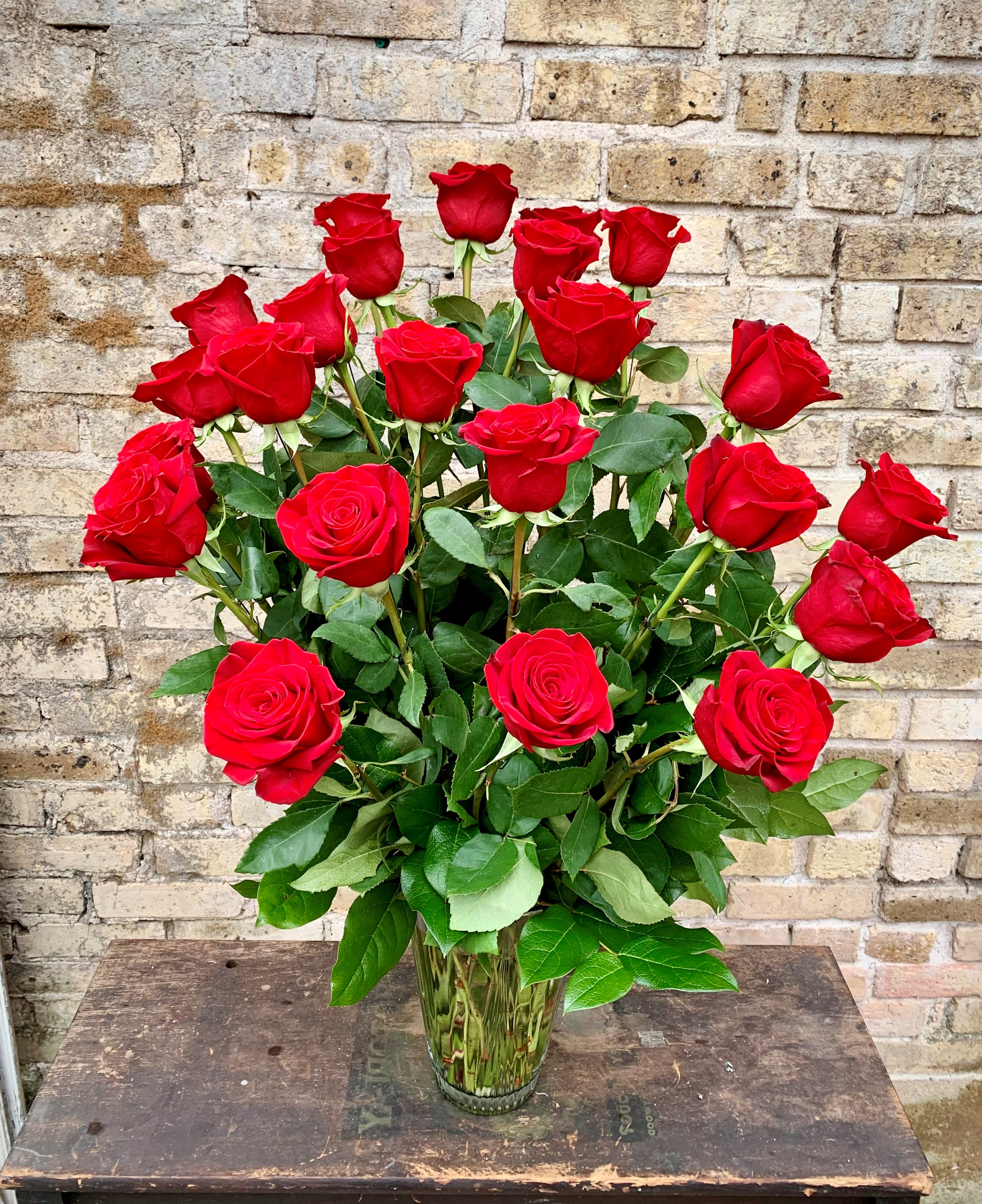 Bouquet of red roses in a clear glass vase