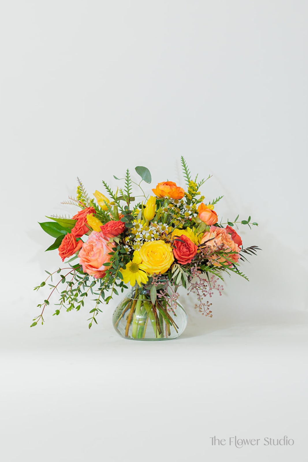 Colorful mixed bouquet in a clear glass vase