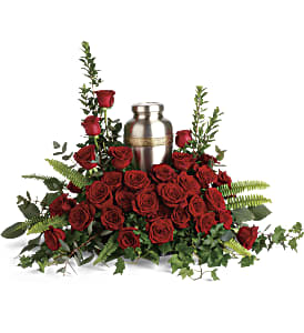 Red rose arrangement with a silver urn centerpiece