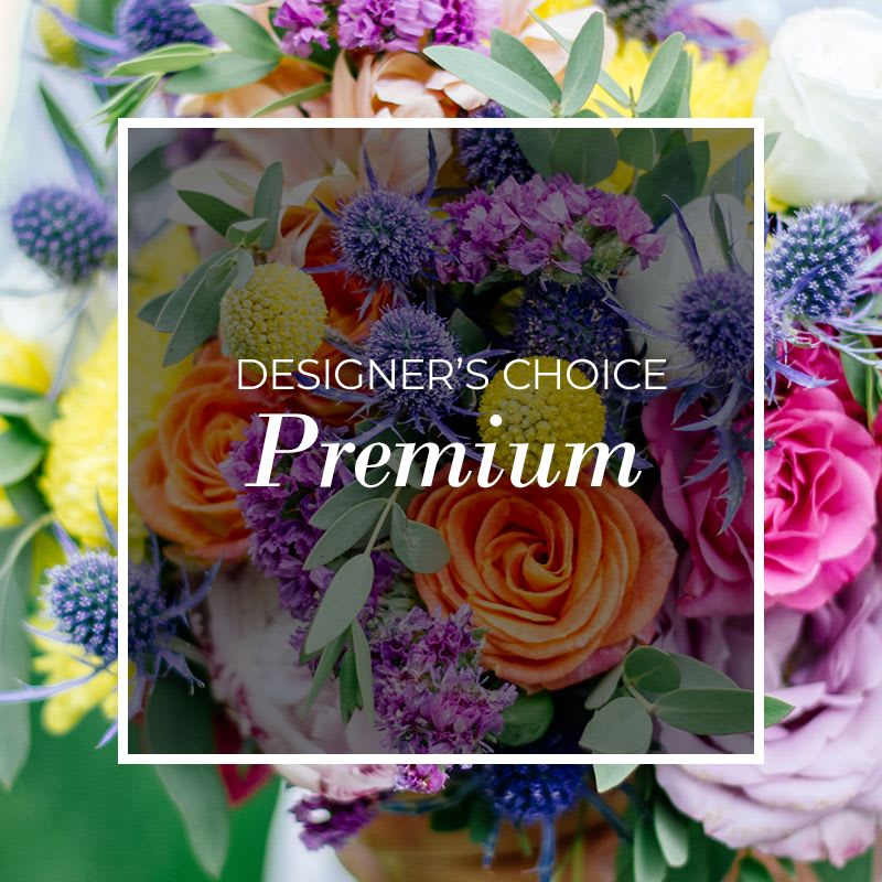 Mixed bouquet with orange roses and purple thistle-like flowers