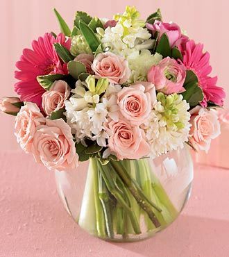 Pink and white mixed bouquet in a clear glass vase