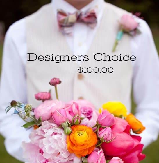 Person holding a colorful bouquet with pink and orange flowers