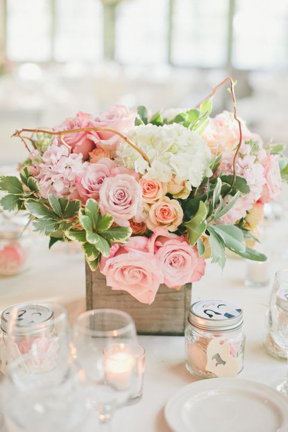 Pink and white rose centerpiece in a wooden box