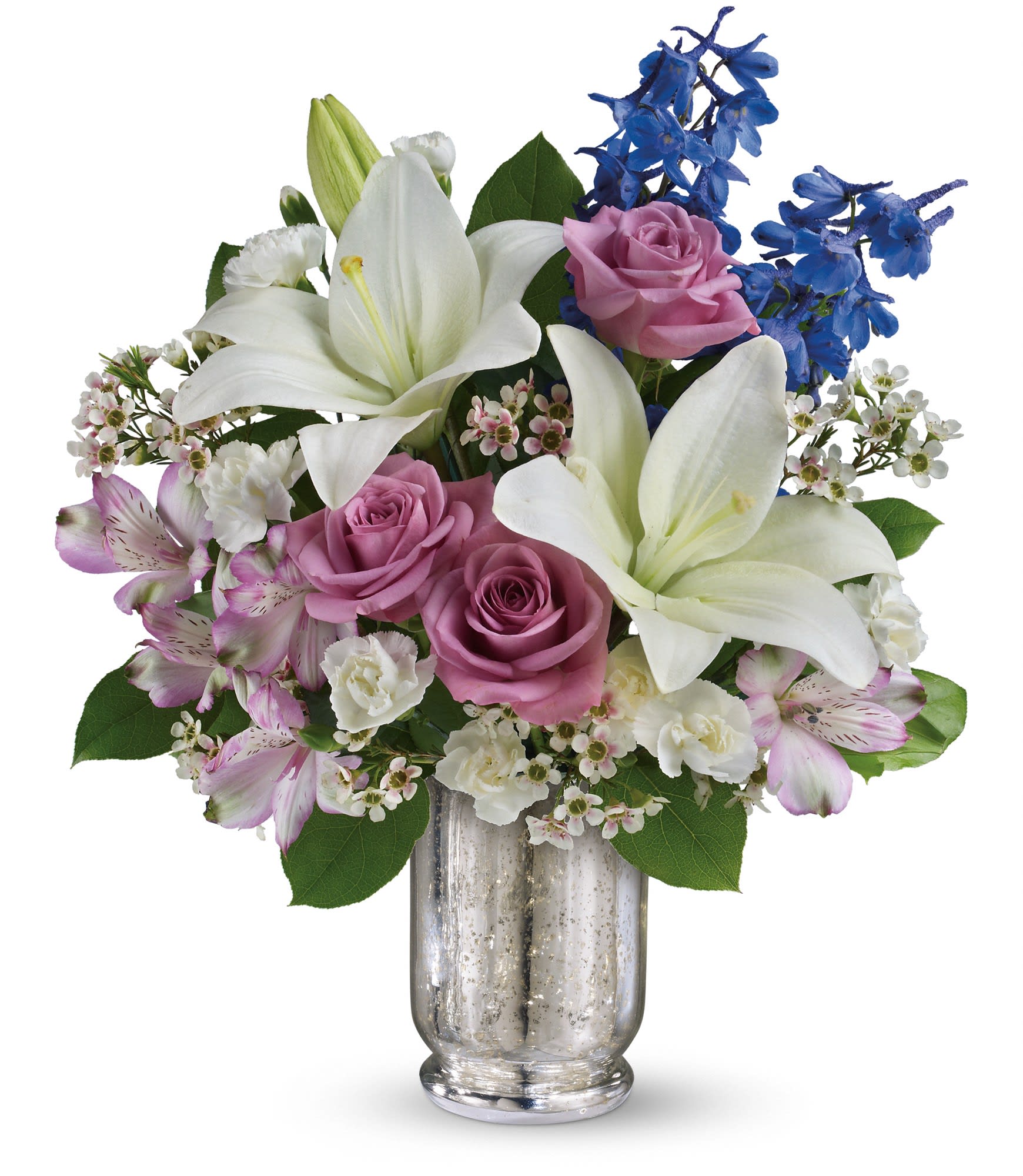 Teleflora's Garden Of Dreams Bouquet (TEV28-3A) - Make her dreams come true with this ethereal bouquet, presented in a stunning Mercury Glass hurricane. Beautiful snow-white lilies, lavender roses and a bright blue hint of delphinium create a dreamy declaration of your affection she'll never forget.  