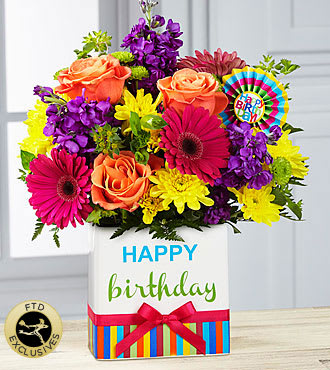 Colorful birthday flower arrangement in a gift box with roses and daisies