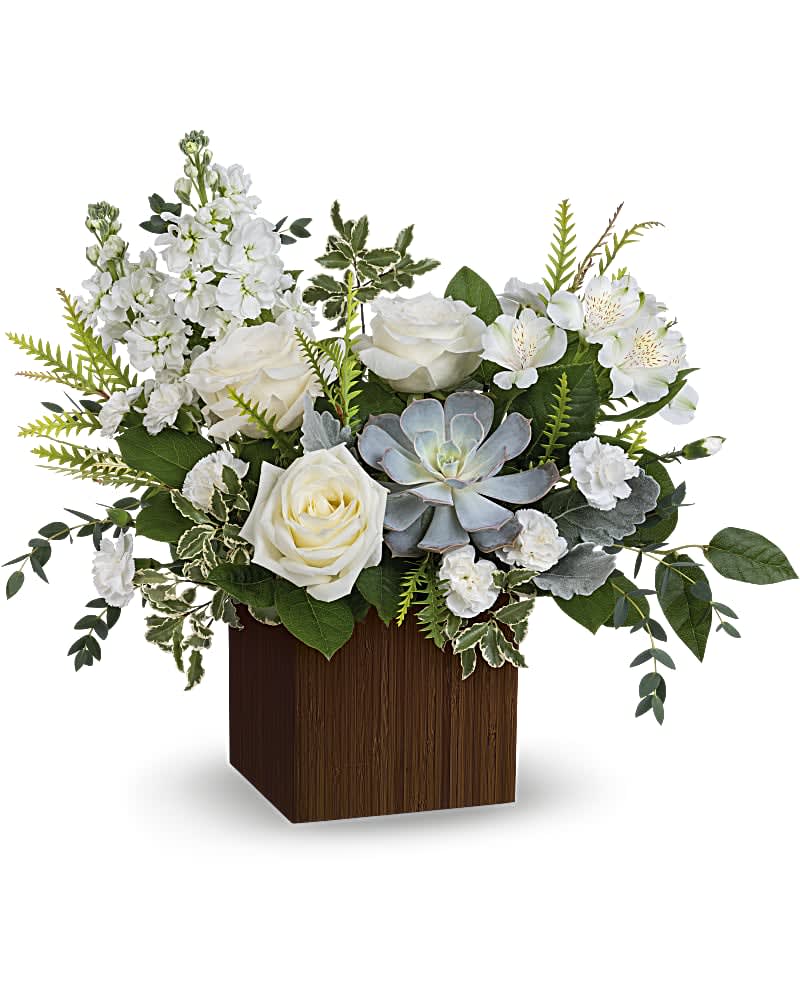 Just Breathe Bouquet - Like a breath of fresh air, this wondrous white bouquet in a Zen-inspired bamboo cube brings peace to any special occasion. This serene bouquet features white roses, white alstroemeria, miniature white carnations, white stock, grevillea, lemon leaf, parvifolia eucalyptus, dusty miller and pitta negra. Delivered in Teleflora's Large Bamboo cube.
