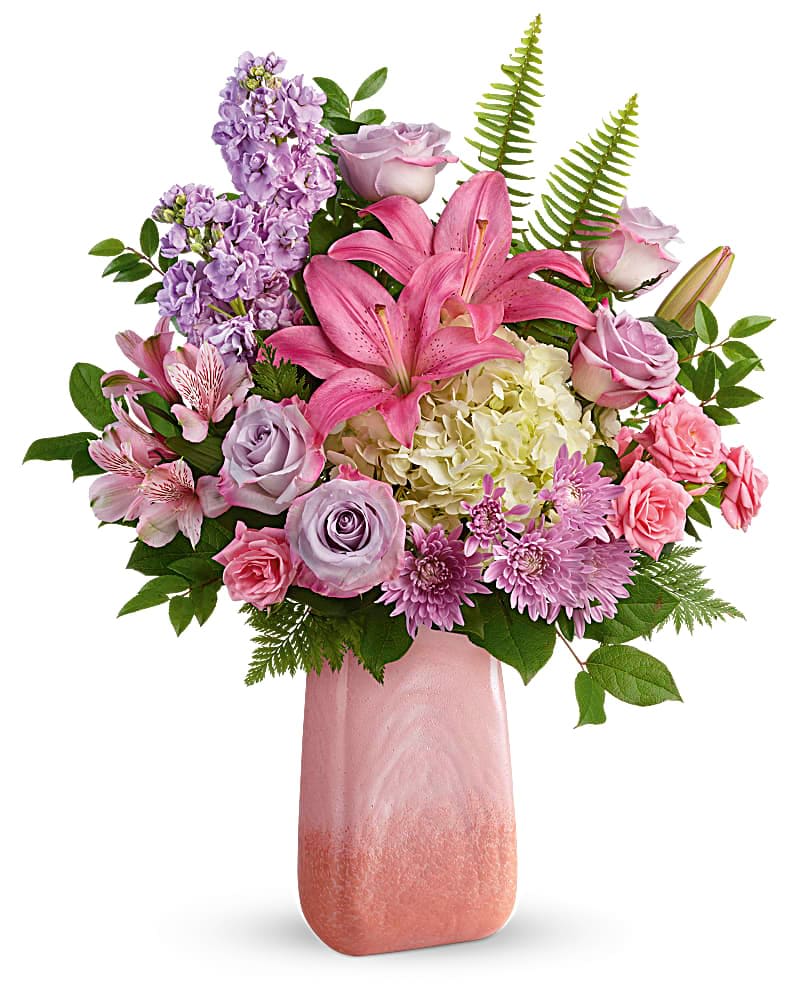 Pink and lavender bouquet with lilies, roses, and hydrangea in a pink vase